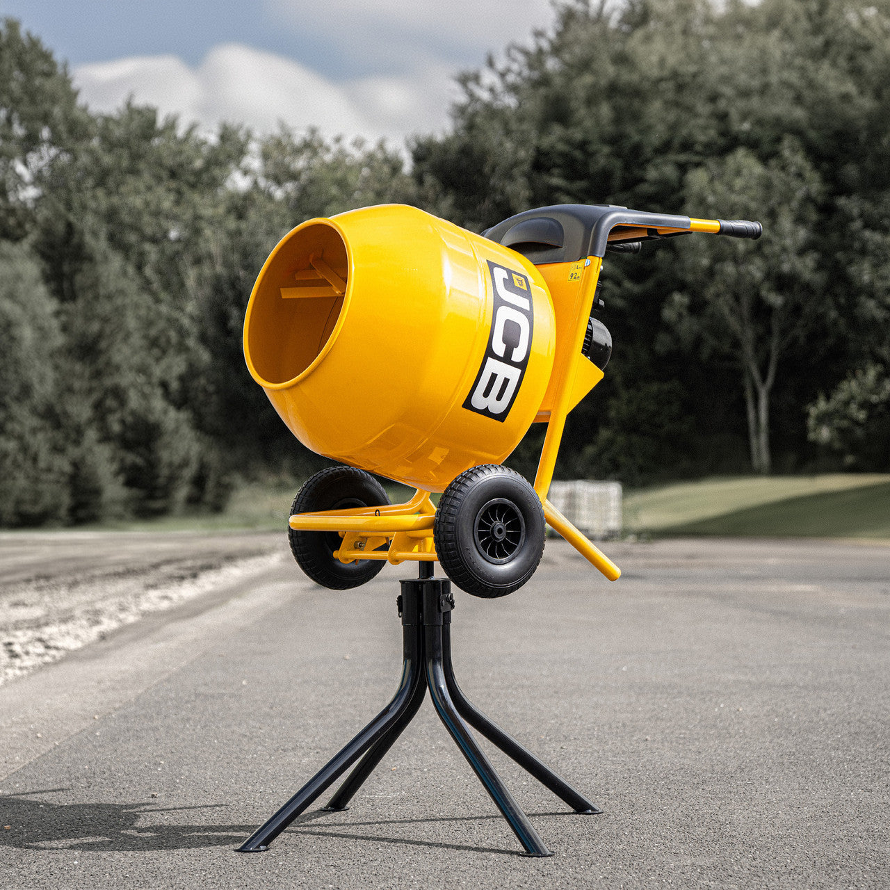 In use JCB 110V 134L Seam Welded Tip Up Cement Mixer 550W Electric Motor | JCB-CM150E-110